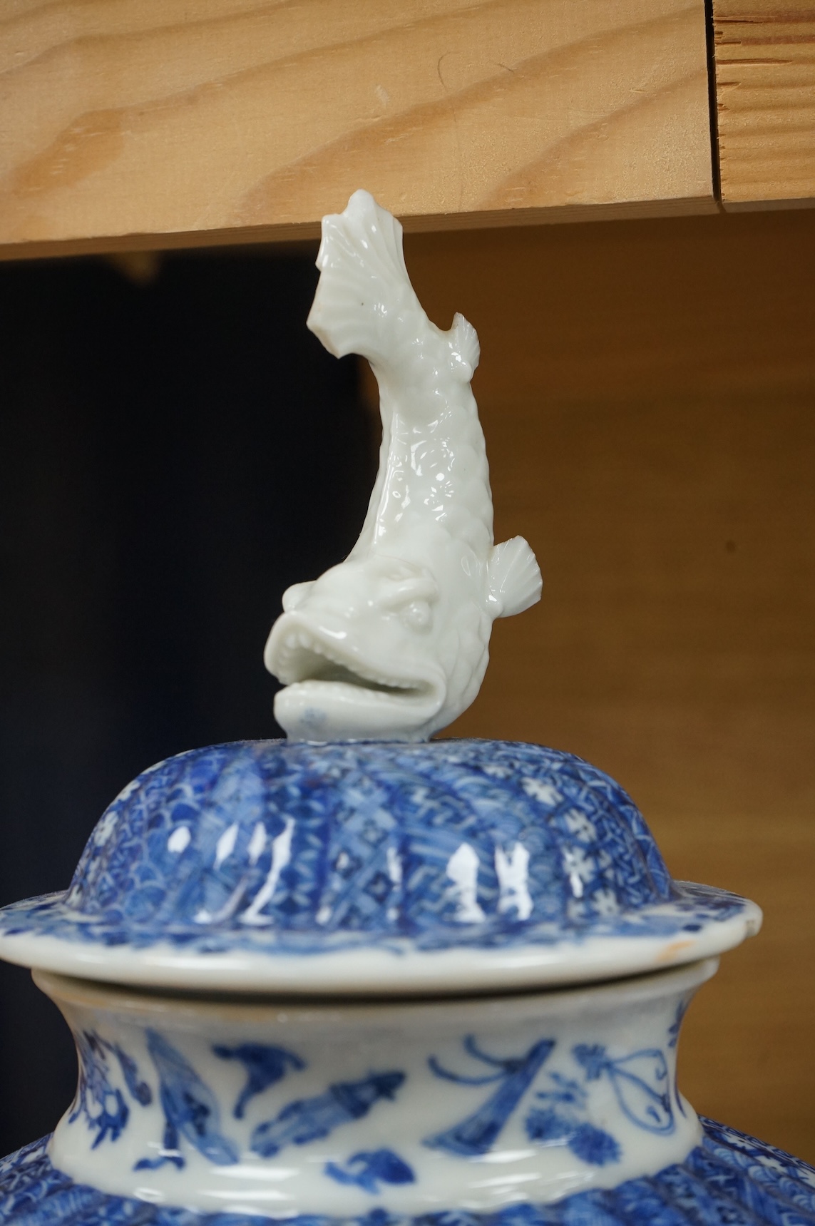 A Japanese blue and white water jar and cover, with fish knop, Meiji period, 31cm high